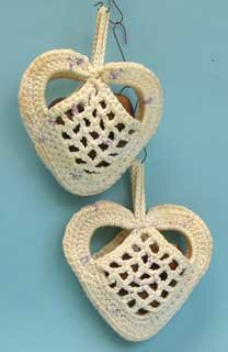 42: two crocheted heart shaped bags.